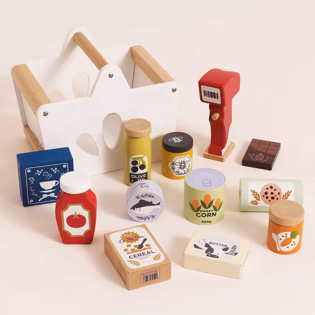 Product information "Groceries Set & Scanner" Spark hours of imaginative play with this beautifully designed wooden grocery playset. It includes a sturdy wooden basket filled with 12 solid wood grocery items and a playful barcode scanner, perfect for pretend shopping adventures. Each item is made from FSC™-certified wood and features charming, colorful illustrations to engage young minds. The set includes familiar favorites like butter, honey, cookies, cereal, ketchup, olive oil, spaghetti, chocolate, tea, a jar of sweet corn and carrots, and a can of tuna. Each piece is perfectly sized for small hands and encourages hands-on learning. Ideal for role play, counting, and building vocabulary, this set helps children develop fine motor skills, early math concepts, and social interaction through creative storytelling and play. A wonderful addition to any toy kitchen or play store setup! Specifications Suitable for ages 3 years+ Dimensions: Shopping Basket – W:19 x D:13.1 x H:15.3cm Made of FSC®-certified wood Decorated using water based, non-toxic paints