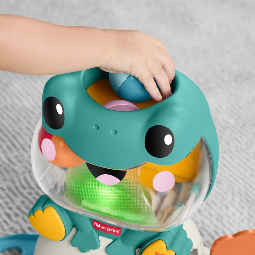Interaktiv Fisher Price-groda med ljus, musik och 4 bollar. Barnet tappar bollarna och hittar dem igen. Stimulerar motorik och inlärning från 6 månader.